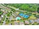 Aerial view of the community pool and tennis courts surrounded by lush landscaping at 1370 Sunnys Halo Dr, Suwanee, GA 30024