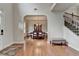 Spacious foyer with hardwood floors, staircase, and view to the dining room at 1370 Sunnys Halo Dr, Suwanee, GA 30024