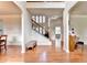 Open foyer with staircase, hardwood floors, and natural light at 1370 Sunnys Halo Dr, Suwanee, GA 30024