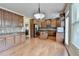 A modern kitchen with stainless steel appliances, granite countertops, and wood cabinets at 1370 Sunnys Halo Dr, Suwanee, GA 30024