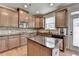 Charming kitchen with wood cabinets, granite countertops, and stainless steel appliances at 1370 Sunnys Halo Dr, Suwanee, GA 30024