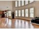 Spacious living room with hardwood floors and large windows offering ample natural light at 1370 Sunnys Halo Dr, Suwanee, GA 30024