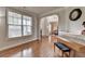 Bright living room with hardwood floors, large windows, and classic piano at 1370 Sunnys Halo Dr, Suwanee, GA 30024