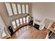 Living room boasting high ceilings, expansive windows, fireplace and gleaming hardwood floors at 1370 Sunnys Halo Dr, Suwanee, GA 30024
