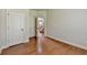 Spacious living room featuring hardwood floors and a view of the staircase at 1370 Sunnys Halo Dr, Suwanee, GA 30024