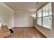 Bright living room with hardwood floors and a large window at 1370 Sunnys Halo Dr, Suwanee, GA 30024