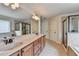 Bright main bathroom featuring a double vanity, a soaking tub and a shower at 1370 Sunnys Halo Dr, Suwanee, GA 30024