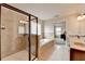 Bright main bathroom featuring a double vanity, a soaking tub and a glass enclosed shower at 1370 Sunnys Halo Dr, Suwanee, GA 30024