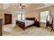 Spacious main bedroom with tray ceilings, neutral carpet, sitting area, and ample natural light at 1370 Sunnys Halo Dr, Suwanee, GA 30024