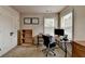 Comfortable carpeted office space with desk and a filing cabinet, next to the large closet at 1370 Sunnys Halo Dr, Suwanee, GA 30024