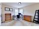 Spacious office space with natural light, with shelves and a rolling desk chair. Ready to work at 1370 Sunnys Halo Dr, Suwanee, GA 30024