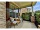 Cozy porch with wicker furniture and decorative pillows at 1370 Sunnys Halo Dr, Suwanee, GA 30024