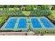 Well-maintained community tennis courts offer opportunities for active recreation in a lushly landscaped setting at 1370 Sunnys Halo Dr, Suwanee, GA 30024