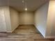 Basement area featuring wood-look floors and neutral walls. This room is ready to be customized at 257 Depot Landing Rd # 39, Auburn, GA 30011