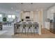 Well-lit kitchen island with seating, stainless steel appliances, and open layout at 257 Depot Landing Rd # 39, Auburn, GA 30011