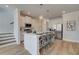 Stylish kitchen with stainless steel appliances, seating, and open access to stairs at 257 Depot Landing Rd # 39, Auburn, GA 30011