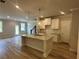 Open kitchen featuring a granite island, stainless steel sink, and ample cabinet space at 257 Depot Landing Rd # 39, Auburn, GA 30011