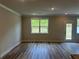 Bright living room with hard surface floors and access to the backyard at 257 Depot Landing Rd # 39, Auburn, GA 30011