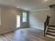 Bright living room with hard surface floors and access to the backyard at 257 Depot Landing Rd # 39, Auburn, GA 30011
