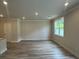 Bright living room with hard surface floors and a large window at 257 Depot Landing Rd # 39, Auburn, GA 30011