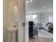 View through door to half bath featuring a pedestal sink and access to the living room at 257 Depot Landing Rd # 39, Auburn, GA 30011