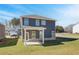 Expansive backyard featuring a two-story home with a covered patio, perfect for outdoor living at 266 Tulip Dr, Covington, GA 30016