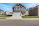 Charming two-story home with gray siding, white trim, and a two-car garage in a suburban neighborhood at 266 Tulip Dr, Covington, GA 30016