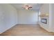 Bright living room features modern fireplace and mantle at 266 Tulip Dr, Covington, GA 30016