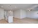 Open-concept living room features hardwood floors and modern lighting fixtures at 266 Tulip Dr, Covington, GA 30016