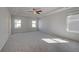 Spacious main bedroom with recessed ceiling and large windows at 266 Tulip Dr, Covington, GA 30016