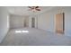 Expansive main bedroom with tray ceiling, carpet floors, and natural light at 266 Tulip Dr, Covington, GA 30016