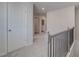 Upstairs landing features plush carpet and modern doors at 266 Tulip Dr, Covington, GA 30016