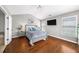 Charming bedroom with hardwood floors, a comfortable bed, and ample natural light at 3857 Felton Hill Sw Rd # 9, Smyrna, GA 30082