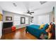 Bedroom featuring hardwood floors, ample natural light, and a comfortable bed at 3857 Felton Hill Sw Rd # 9, Smyrna, GA 30082