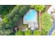 Aerial view of the community pool surrounded by mature trees and landscaping at 3857 Felton Hill Sw Rd # 9, Smyrna, GA 30082