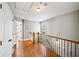 Upstairs hallway with hardwood floors and wrought iron banister at 3857 Felton Hill Sw Rd # 9, Smyrna, GA 30082