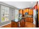 Kitchen features hardwood floors, center island, stainless appliances, and natural light at 3857 Felton Hill Sw Rd # 9, Smyrna, GA 30082