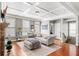 Bright living room with a coffered ceiling, stone fireplace, large windows, and comfortable seating for relaxation at 3857 Felton Hill Sw Rd # 9, Smyrna, GA 30082