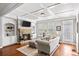 Cozy living room featuring a stone fireplace, built-in cabinetry, coffered ceilings, and large windows with natural light at 3857 Felton Hill Sw Rd # 9, Smyrna, GA 30082