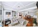 Open living and dining area with hardwood floors, a stone fireplace, and comfortable seating for relaxation at 3857 Felton Hill Sw Rd # 9, Smyrna, GA 30082