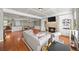 Open-concept living room with a fireplace, built-in shelves, and an adjacent dining area perfect for entertaining guests at 3857 Felton Hill Sw Rd # 9, Smyrna, GA 30082