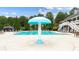 View of a large, inviting community pool with a unique splash umbrella and comfortable seating at 3857 Felton Hill Sw Rd # 9, Smyrna, GA 30082