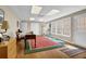 Finished basement with hardwood floors, natural light, desk and multiple doorways at 4566 Fountain Ne Dr, Marietta, GA 30067