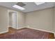 Finished basement area with hardwood floor and an open closet at 4566 Fountain Ne Dr, Marietta, GA 30067