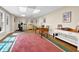 Open finished basement space with desk, workout area, neutral paint, and lots of light at 4566 Fountain Ne Dr, Marietta, GA 30067