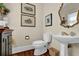 Charming powder room with pedestal sink and decorative mirror at 4566 Fountain Ne Dr, Marietta, GA 30067