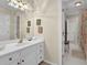 A well-lit bathroom vanity area with tile flooring and open doorway at 4566 Fountain Ne Dr, Marietta, GA 30067