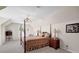 Comfortable bedroom featuring a canopy bed, side tables, and natural light from the window at 4566 Fountain Ne Dr, Marietta, GA 30067