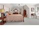 Serene bedroom showcasing a canopy bed, classic furnishings, and ample space for relaxation at 4566 Fountain Ne Dr, Marietta, GA 30067