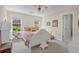 Bedroom featuring a white bed frame, bright windows, and neutral walls at 4566 Fountain Ne Dr, Marietta, GA 30067